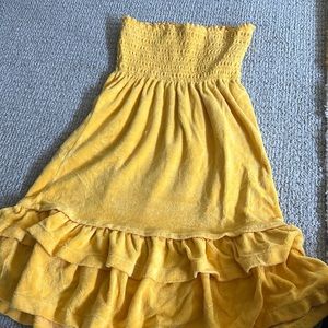 Yellow terry cloth strapless with two ruffles at the bottom. Juicy couture